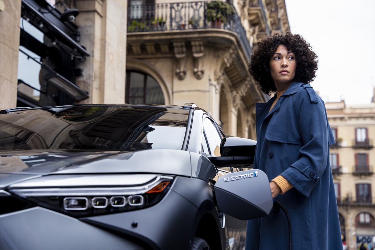 Woman next to car